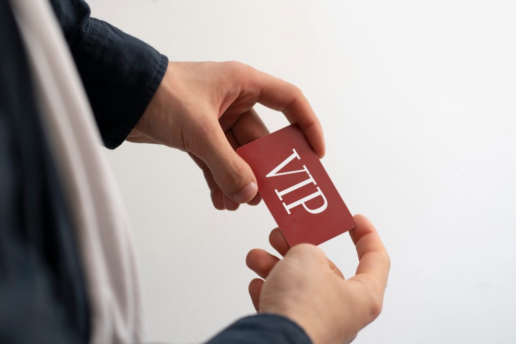 a person showing VIP card pass, exclusive access membership